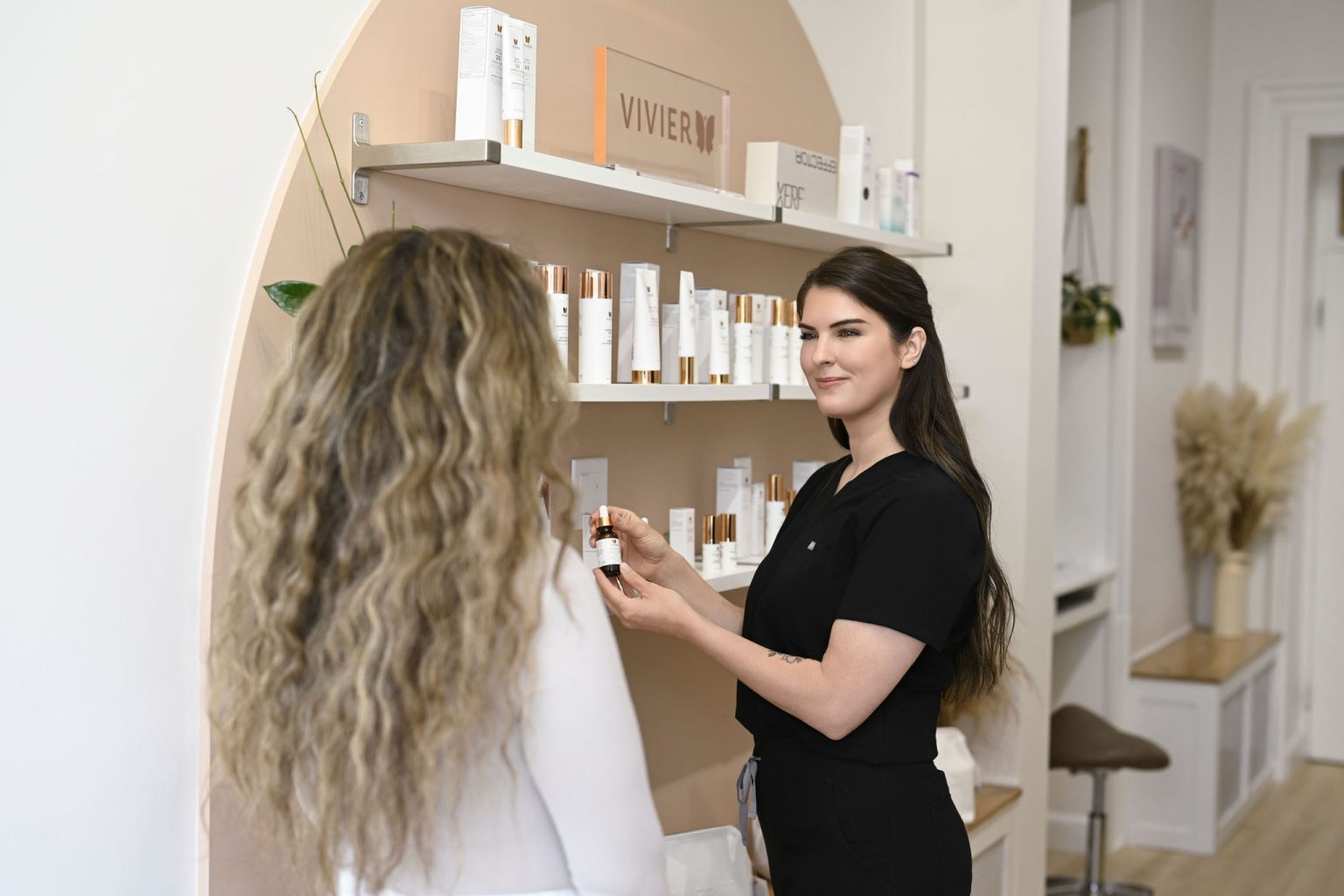 aesthetic nurse and patient in front of medical grade skincare in Arnprior Ontario