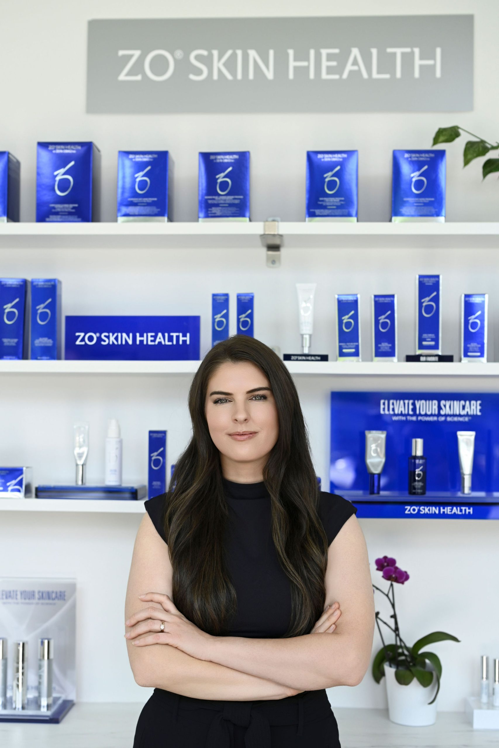 Stacey Foster standing in front of ZO Skin Health products in Arnprior Ontario